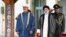 FILE - In this photo released by the office of the Iranian Presidency, Oman's Sultan Haitham bin Tariq Al Said, left, and Iranian President Ebrahim Raisi attend the official welcoming ceremony for Sultan Haitham at the Saadabad Palace in Tehran, May 28, 2023. 