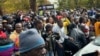 Demonstrators gather outside Harare Magistrates Court in June 2024. The protest led to the arrest of more than 100 activists, as the country prepares to host the Southern African Development Community summit on Aug. 17, 2024. 