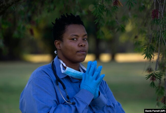 South African doctor Zolelwa Sifumba, a former TB patient, poses for a photograph, in Johannesburg, Thursday, Nov. 11, 2023. (AP Photo/Denis Farrell)