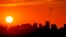 A jet takes flight from Sky Harbor International Airport as the sun sets over downtown Phoenix, Arizona, July 12, 2023.