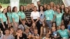 First lady Olena Zelenska, in white, poses for a photo during her visit to a rehabilitation camp for war-affected children, organized by the Voices of Children Charitable Foundation and financially supported by the Olena Zelenska Foundation, in Uzhhorod, Ukraine, Aug. 27, 2024.