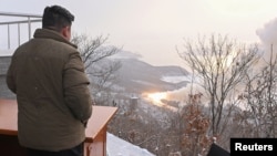 North Korean leader leader Kim Jong Un guides a rocket motor test at the Sohae Satellite Launching Ground in Tongchang-ri, North Korea, Dec. 15, 2022, in this photo released by North Korea's Korean Central News Agency.