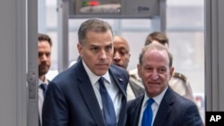 Hunter Biden, left, son of President Joe Biden, arrives with attorney Abbe Lowell at the O'Neill House Office Building for a closed-door deposition in a Republican-led investigation into the Biden family, on Capitol Hill in Washington, Feb. 28, 2024.