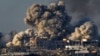 FILE — Smoke rises following an Israeli bombardment in the Gaza Strip, Dec. 16, 2023. South Africa has launched a case at the United Nations' top court alleging that Israel's military campaign in Gaza amounts to genocide.