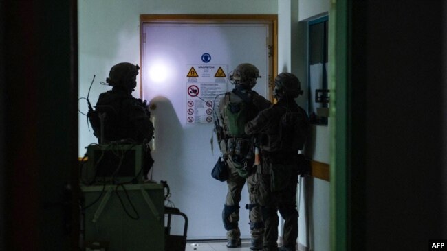 This handout picture released by the Israeli army on Nov. 15, 2023, reportedly shows Israeli soldiers carrying out operations inside Al-Shifa hospital in Gaza City. (Photo by Israeli army / AFP)