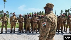 FILE - Soldiers from Burkina Faso's army line up for training organized by the International Counter-Terrorism Academy in Jacqueville, Ivory Coast, March 14, 2023. 