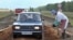 FILE - A veterinarian hoses a car with disinfectant to prevent the spread of anthrax near the village of Druzhba, Russia, Aug. 29, 2012. Five countries in Africa are in the middle of outbreaks of the anthrax disease, with 20 deaths reported so far in 2023.