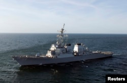 FILE - Guided missile destroyer USS Laboon is under way in the Atlantic Ocean, March 12, 2012.