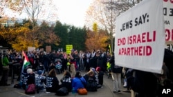 FILE - Protesters gather to occupy the main entrance to the Space Needle during a rally demanding that Sen. Patty Murray, D-Wash., call for a cease-fire in the Israel-Hamas war, Nov. 19, 2023, in Seattle.