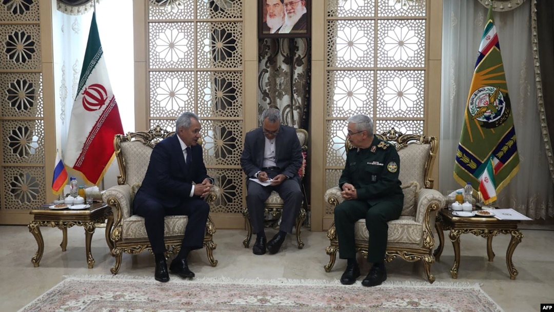 A handout picture provide by the Iranian Army media office shows Iran's army Chief of Staff Mohammad Bagheri, right, greeting Russia's Security Council Secretary Sergei Shoigu, in Tehran, Aug. 5, 2024. 