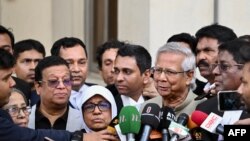 Bangladeshi Nobel peace laureate Muhammad Yunus (4R) addresses the media as leaves a court in Dhaka, Jan. 28, 2024. 