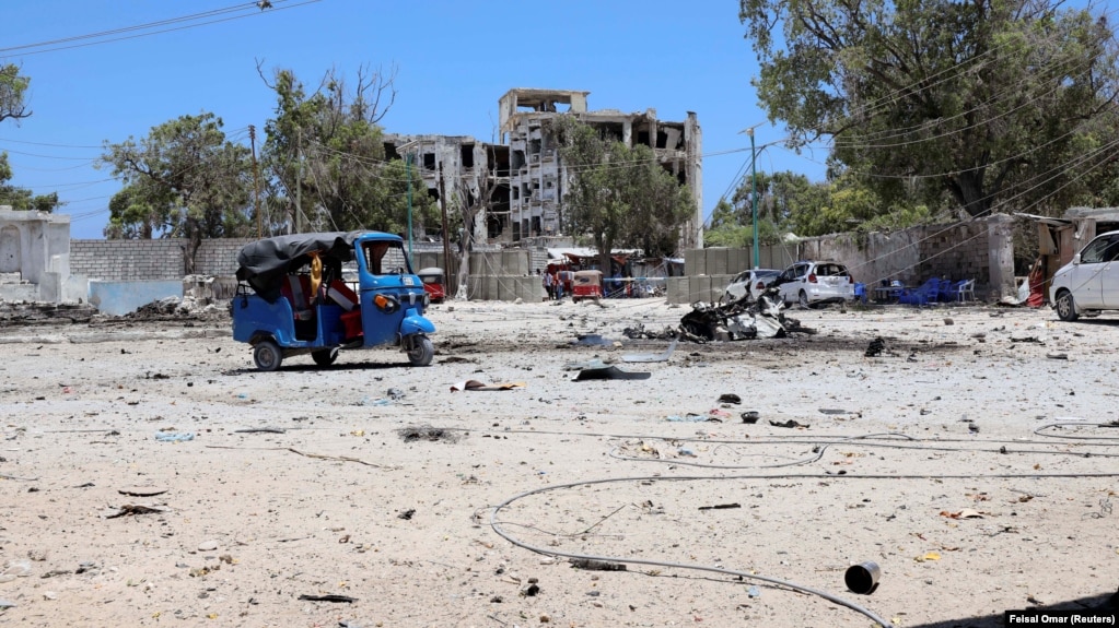 (FILE) The wreckage of a suicide car explosion after al-Shabaab militia stormed a government building in Somalia.