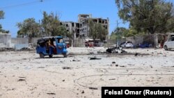 (FILE) The wreckage of a suicide car explosion after al-Shabaab militia stormed a government building in Somalia.