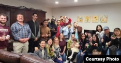 FILE - Professor Sarah Mannix and international students from the English Language Center at Old Dominion University celebrate Thanksgiving at her house in 2023.