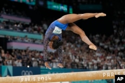 Simone Biles of the United States performs on the balance beam during the women's artistic gymnastics all-around finals in Bercy Arena at the 2024 Summer Olympics in Paris, Aug. 1, 2024.