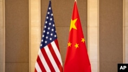 FILE - United States and Chinese flags are set up before a meeting between Treasury Secretary Janet Yellen and Chinese Vice Premier He Lifeng in Beijing, on July 8, 2023. 