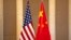 FILE - United States and Chinese flags are set up before a meeting between Treasury Secretary Janet Yellen and Chinese Vice Premier He Lifeng in Beijing, on July 8, 2023. 
