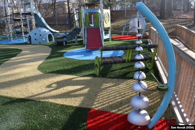 Behind the sound-maker lies a bench with many different colors. If a child starts to feel uneasy, they can sit down and feel the bench, which can help them relax. (Dan Novak/VOA)