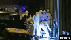 FILE - Belgian police work in Verviers after a counterterror raid, Jan. 15, 2015. Anti-terror investigators said Nov. 10, 2023, that they were holding a suspected member of a rightist group after raids earlier in Ostend and Diepenbeek.