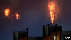 Flames rise from a forest during a wildfire in Bogota, Colombia, on Jan. 24, 2024.