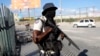 A National Police officer patrols an intersection in Port-au-Prince, Haiti, Jan. 26, 2024.