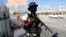 A National Police officer patrols an intersection in Port-au-Prince, Haiti, Jan. 26, 2024.
