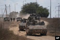 A convoy of Israeli armored personnel carriers (APC) headed towards the Gaza Strip border in southern Israel, Oct. 15, 2023.