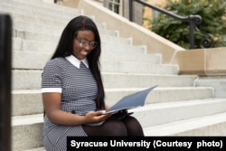 A student at Syracuse University reviews paperwork before a meeting with a career counselor. (Photo courtesy of Syracuse University)