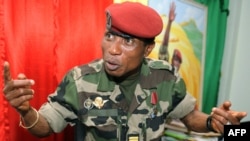 FILE—Guinea's military junta chief, Captain Moussa Dadis Camara, speaks on September 30, 2009. 