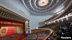Chinese officials and delegates attend the closing session of the National People's Congress (NPC) at the Great Hall of the People in Beijing, China, March 11, 2024. 