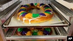 FILE - Mardi Gras King Cakes by pastry chef Jean-Luc Albin are displayed at Maurice French Pastries in Metairie, Louisiana, Feb. 10, 2011. 