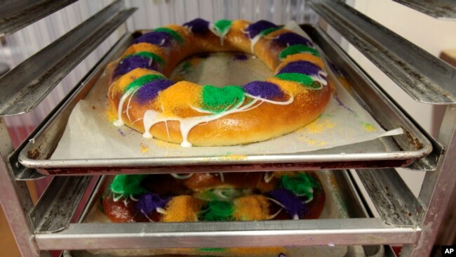 FILE - Mardi Gras King Cakes by pastry chef Jean-Luc Albin are displayed at Maurice French Pastries in Metairie, Louisiana, Feb. 10, 2011.