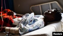 Ugandan LGBTQ activist Steven Kabuye receives treatment at a hospital after he was attacked and stabbed by unknown people, in Kitende on the outskirts of Kampala, Uganda, Jan. 3, 2024