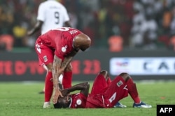 Des joueurs de la Guinée équatoriale réagissent après la défaite de leur équipe.