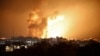 Fire and smoke rise above buildings during an Israeli air strike in Gaza City on Oct. 8, 2023. 