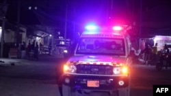 An ambulance is seen outside the perimeter of rescue operations in Mogadishu on June 9, 2023, during an attack on the Pearl Beach hotel.