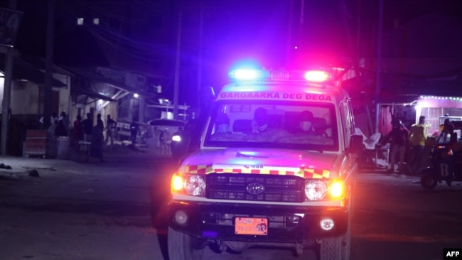 An ambulance is seen outside the perimeter of rescue operations in Mogadishu on June 9, 2023, during an attack on the Pearl Beach hotel.