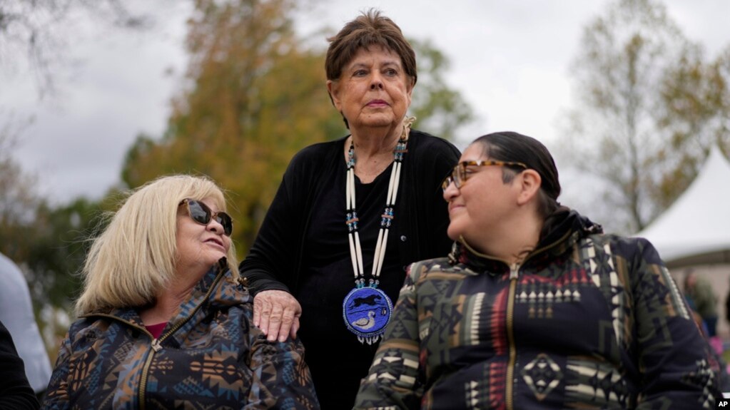 Chief Glenna Wallace, center, of the Eastern Shawnee Tribe of Oklahoma, visits with Sherri Clemons of the Wyandotte Nation, left, and Carol Butler of the Absentee Shawnee Tribe of Oklahoma at Hopewell Culture National Historical Park in Chillicothe, Ohio, Oct. 14, 2023.