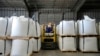 FILE - A worker moves bags of lithium carbonate at an Albemarle Corp. facility, Oct. 6, 2022, in Silver Peak, Nev. 