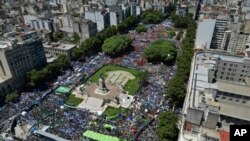 People rally outside Congress during a national strike against the economic and labor reforms proposed by Argentine President Javier Milei's government in Buenos Aires, Jan. 24, 2024. 