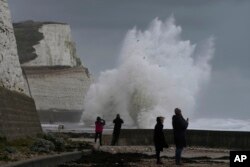Waves crash over the harbor wall in Newhaven, southern England, Nov. 2, 2023. Winds up to 180 kilometers per hour (108 mph) slammed France's Atlantic coast overnight as Storm Ciaran lashed countries in Western Europe.