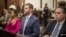 Eric Trump, center, son of former President Donald Trump, is seated ahead of his second day of testimony at New York State Supreme Court, Nov. 3, 2023, in New York. 