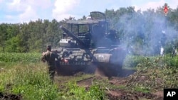 In this photo taken from video released by the Russian Defense Ministry on Aug. 10, 2024, a Russian Army tank takes a position at an area of Kursk region of Russia.