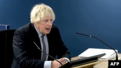 A video grab from footage broadcast by the UK Covid-19 Inquiry shows Britain's former Prime Minister Boris Johnson speaking at the UK COVID-19 Inquiry, in west London, Dec. 6, 2023 to give evidence.