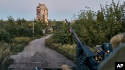 FILE - A Ukrainian soldier sits in his position in Avdiivka, Donetsk region, Ukraine, Aug. 18, 2023. 