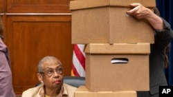 FILE - Delegate Eleanor Holmes Norton, a District of Columbia Democrat, watches as boxes are stacked next to her during a House Oversight Committee impeachment inquiry into President Joe Biden, Sept. 28, 2023, on Capitol Hill in Washington.