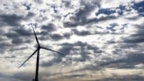 A Block Island Wind Farm turbine operates, Dec. 7, 2023, off the coast of Block Island, Rhode Island, during a tour of the North Fork Wind farm organized by Ørsted.