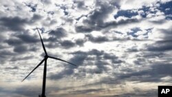 A Block Island Wind Farm turbine operates, Dec. 7, 2023, off the coast of Block Island, Rhode Island, during a tour of the North Fork Wind farm organized by Ørsted.