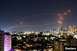 Israel's Iron Dome anti-missile system intercepts rockets launched from the Gaza Strip, after a temporary truce between Israel and the Palestinian Islamist group Hamas expired, as seen from Ashkelon, Israel, Dec. 1, 2023.