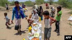 Displaced Yemenis receive humanitarian aid in the Hays region, south of Hodeidah governorate, Yemen, Aug. 16, 2024. Malnutrition is rampant in the country's government-controlled areas.